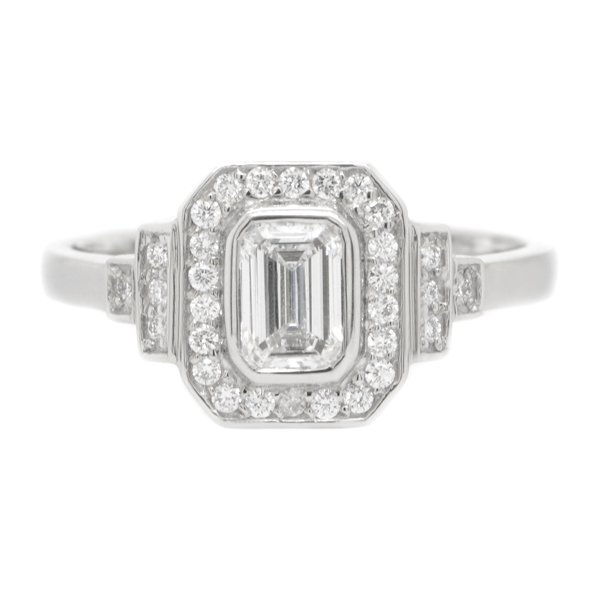 Classic 1920's art deco style emerald cut Diamond halo ring round brilliant cut diamonds surround stepped shoulders platinum gold