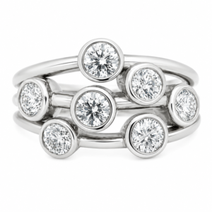 Modern contemporary organic scatter bubble style cluster ring rubbed over round brilliant cut diamond platinum gold