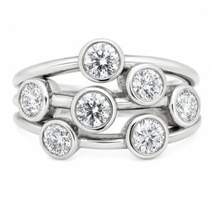 Modern contemporary organic scatter bubble style cluster ring rubbed over round brilliant cut diamond platinum gold