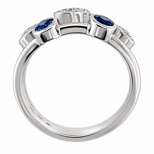 Modern contemporary organic scatter style cluster ring rubbed over round blue sapphires round brilliant cut diamonds platinum gold