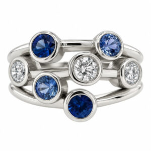 Modern contemporary organic scatter style cluster ring rubbed over round blue sapphires round brilliant cut diamonds platinum gold