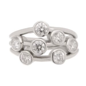 Modern contemporary scatter style cluster ring rubbed over round brilliant cut diamond platinum gold
