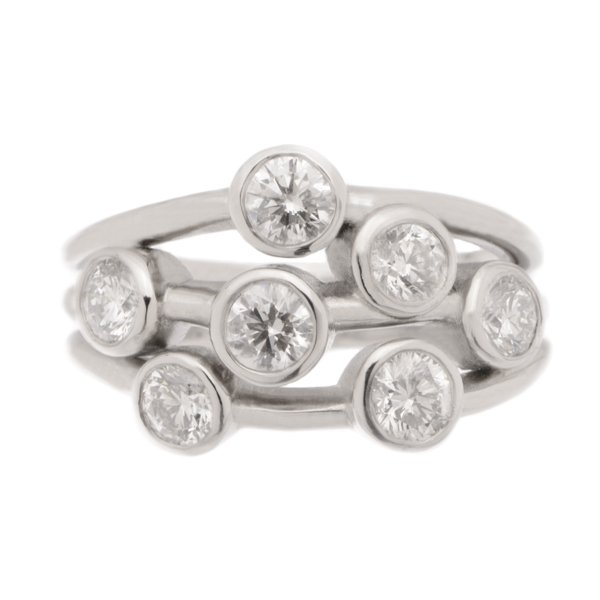 Modern contemporary scatter style cluster ring rubbed over round brilliant cut diamond platinum gold