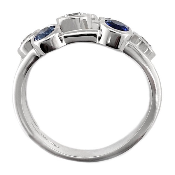 Modern contemporary scatter style cluster ring rubbed over round blue sapphires round brilliant cut diamonds platinum gold
