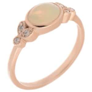 Art deco vintage style oval shape water opal round brilliant cut diamond trefoil cluster style ring platinum gold