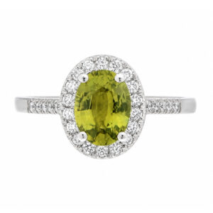 classic oval shape cut green sapphire with round brilliant cut diamonds halo cluster claw set ring platinum gold
