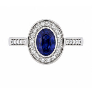 classic rubover rubbed over oval shape cut blue sapphire round brilliant cut diamonds halo cluster grain set engagement ring platinum gold