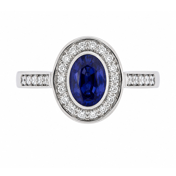 classic rubover rubbed over oval shape cut blue sapphire round brilliant cut diamonds halo cluster grain set engagement ring platinum gold