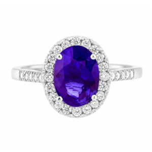 classic oval shape cut tanzanite with round brilliant cut diamonds halo cluster claw set ring platinum gold