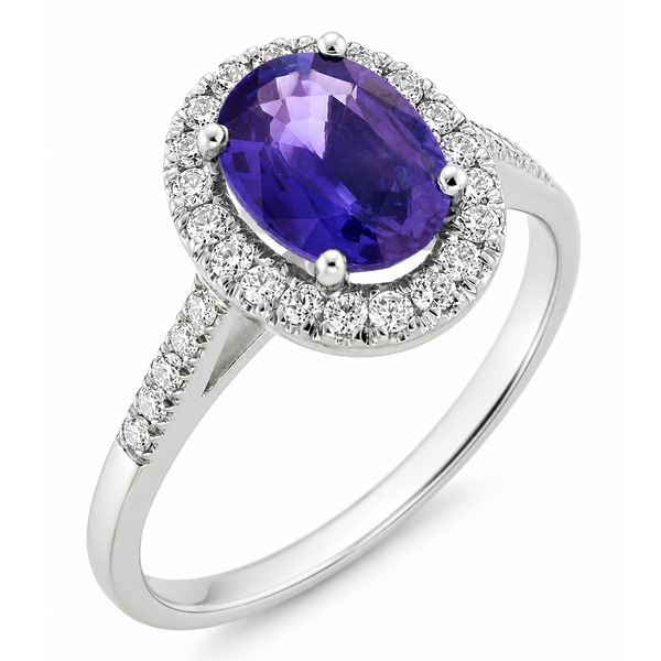classic oval shape cut tanzanite with round brilliant cut diamonds halo cluster claw set ring platinum gold