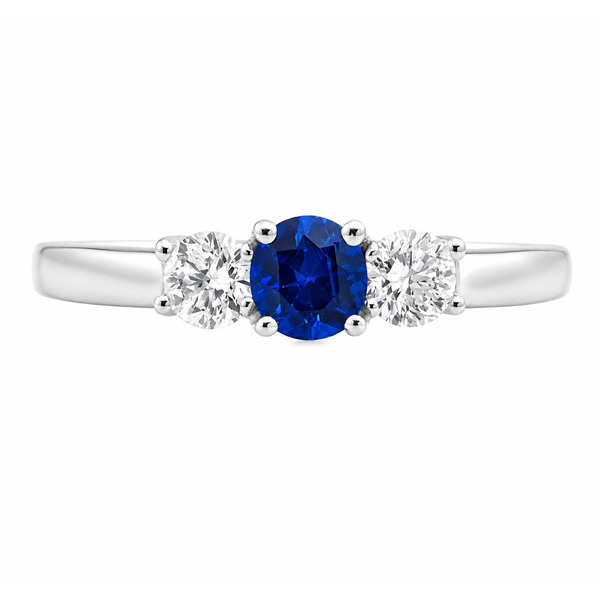 classic trilogy style ring round blue sapphire centre stone & two round brilliant cut diamonds claw set setting gold platinum