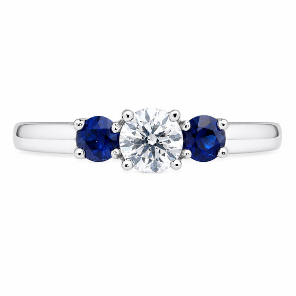 classic trilogy style ring round diamond centre stone & two blue sapphire side stones claw set setting gold platinum