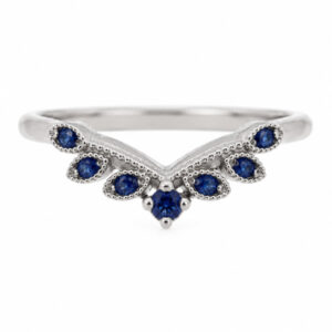A vintage style wishbone shaped floral petal eternity ring set Round blue sapphire millgrain design Platinum Gold