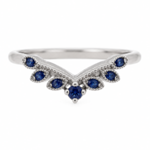 A vintage style wishbone shaped floral petal eternity ring set Round blue sapphire millgrain design Platinum Gold
