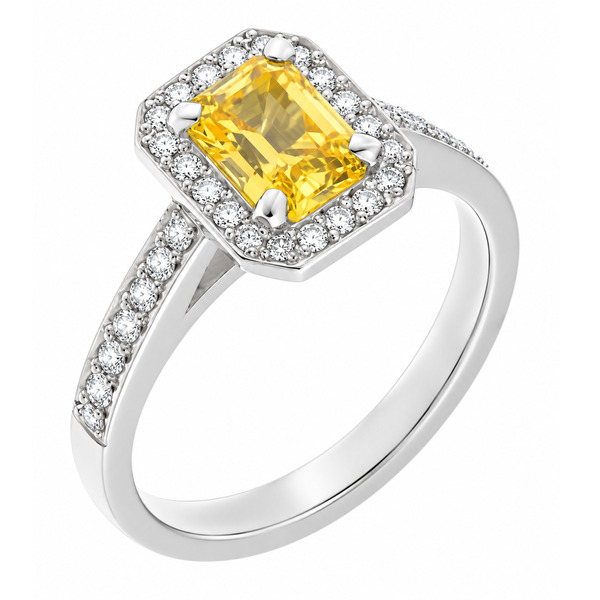 classic Art Deco style cluster ring with emerald cut centre Yellow Sapphire claw setting grain set round brilliant cut diamonds set shoulders halo surround platinum gold