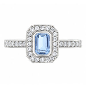 classic Art Deco style cluster ring with emerald cut centre Aqua aquamarine rubover setting grain set round brilliant cut diamonds set shoulders halo surround platinum gold